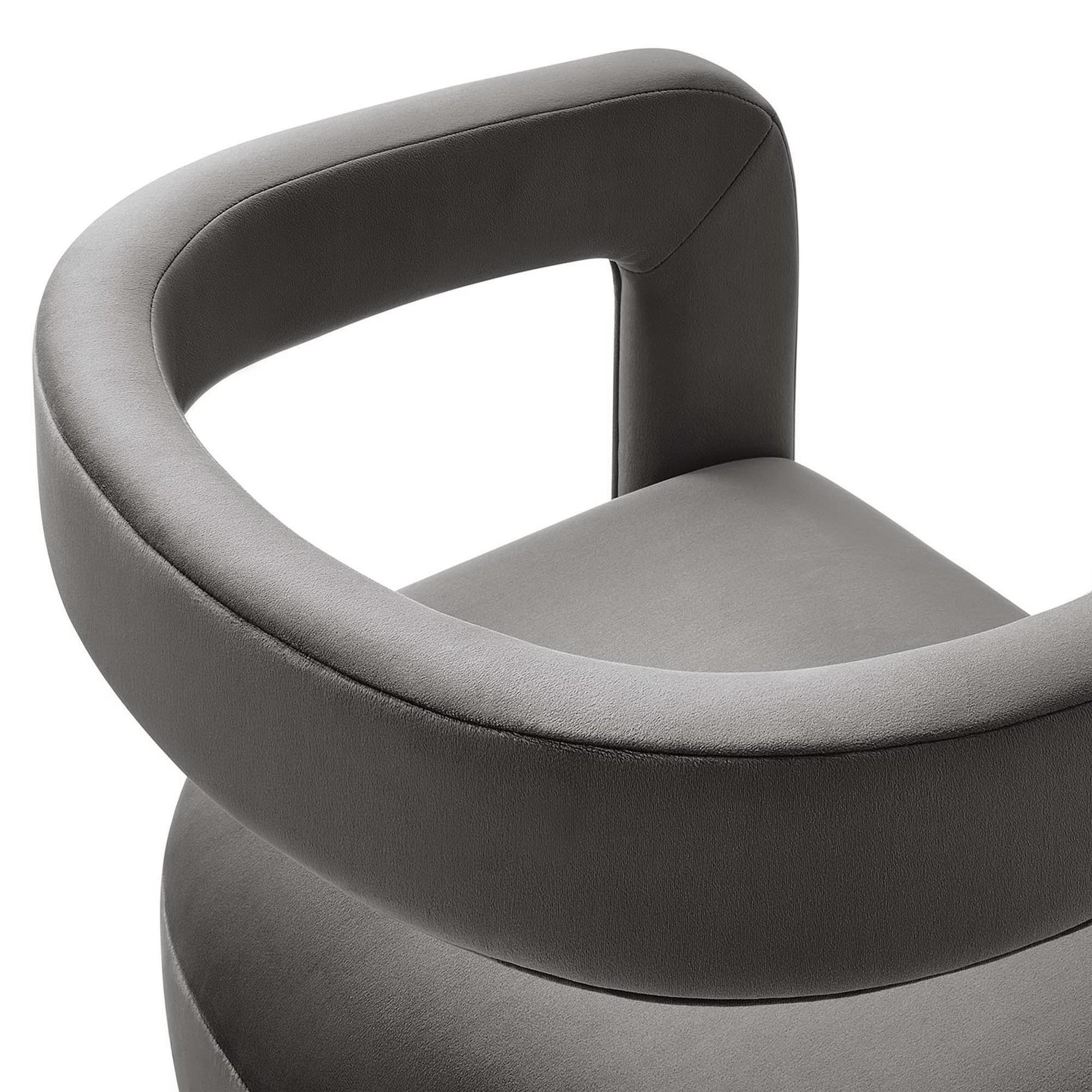 Gray velvet barrel accent chair with wraparound circular armrest and cushioned seat, modern contemporary design.