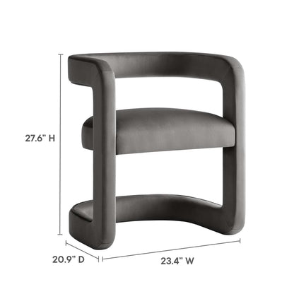 Grey velvet padded barrel accent chair with a rounded, continuous loop back; modern armless seating.