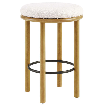 Round oak counter stool with an ivory boucle cushioned seat, four legs and a black circular footrest.