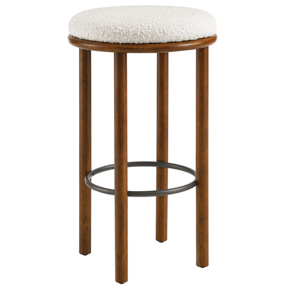 Pair of walnut-finish wooden bar stools with ivory boucle upholstered round seats and circular metal footrests.