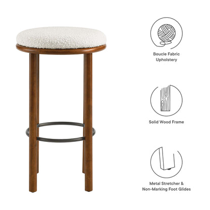 Set of 2 walnut wood bar stools with round ivory boucle upholstered seats, solid wood frames & metal footrests.