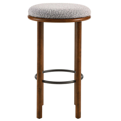 Pair of round taupe boucle fabric bar stools with walnut-finish wooden legs and metal ring footrests