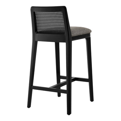 Black bar stool with woven back panel and gray upholstered seat, metal frame.