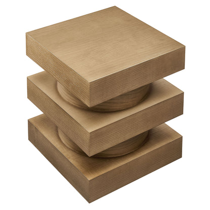 Three natural wood blocks stacked to form a small end table, with circular discs visible in their centers.