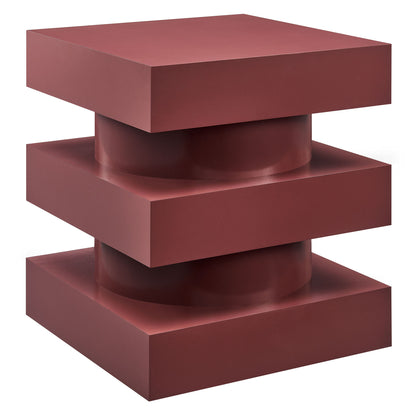 Red metal end table with a geometric totem-style base: three stacked square blocks around a central cylindrical core; modern decor.