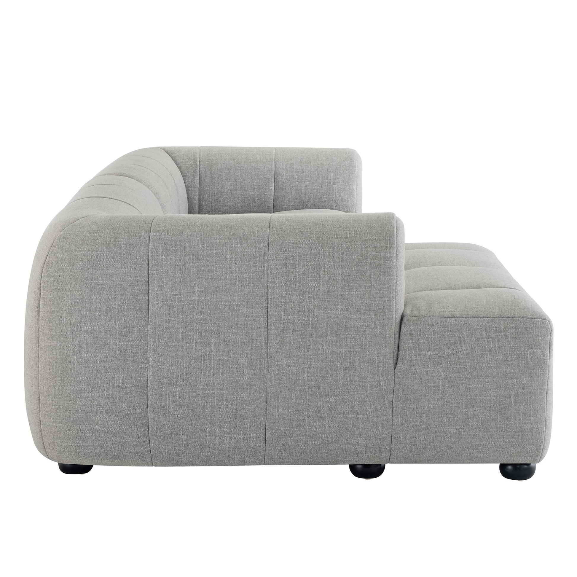 Grey curved fabric modular sofa with a left-facing chaise & low black feet.