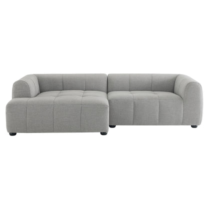 Light gray L-shaped sectional sofa with tufted cushions, left chaise, rounded arms, soft fabric.