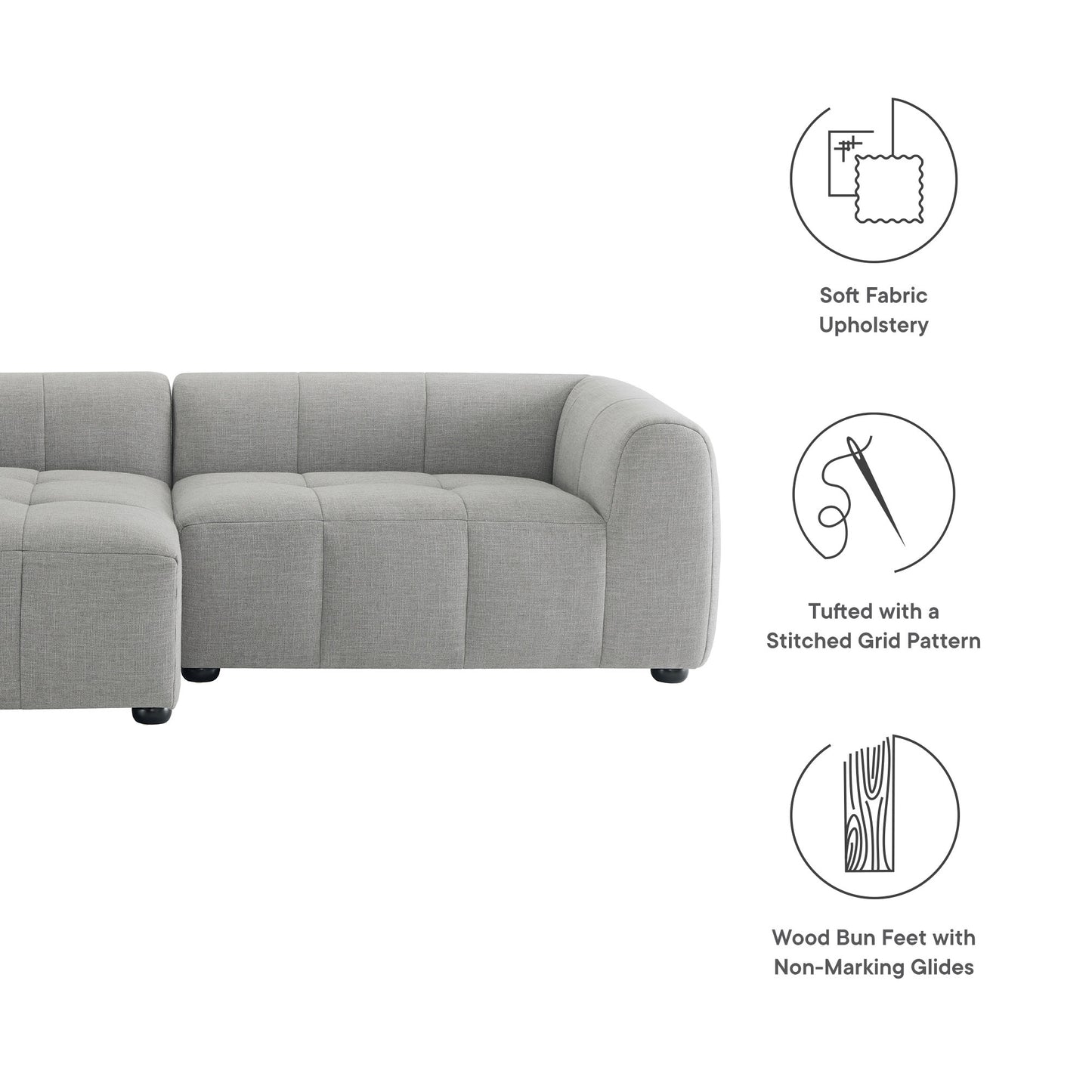 Light gray fabric modular sectional sofa with tufted stitched grid pattern cushions and wood bun feet with non-marking glides.