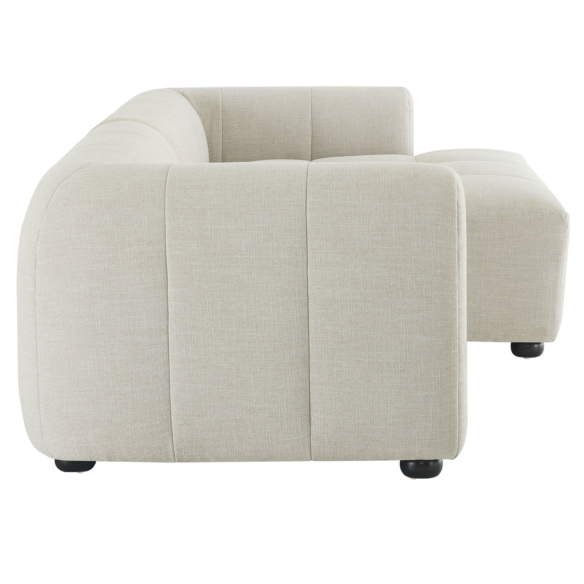 White right-facing upholstered fabric modular sofa with chaise; modular sectional with curved arms, vertical seam panels, and low-profile feet.