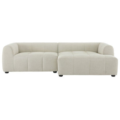 White upholstered fabric modular sofa with chaise, right-facing, rounded arms and low-profile black legs