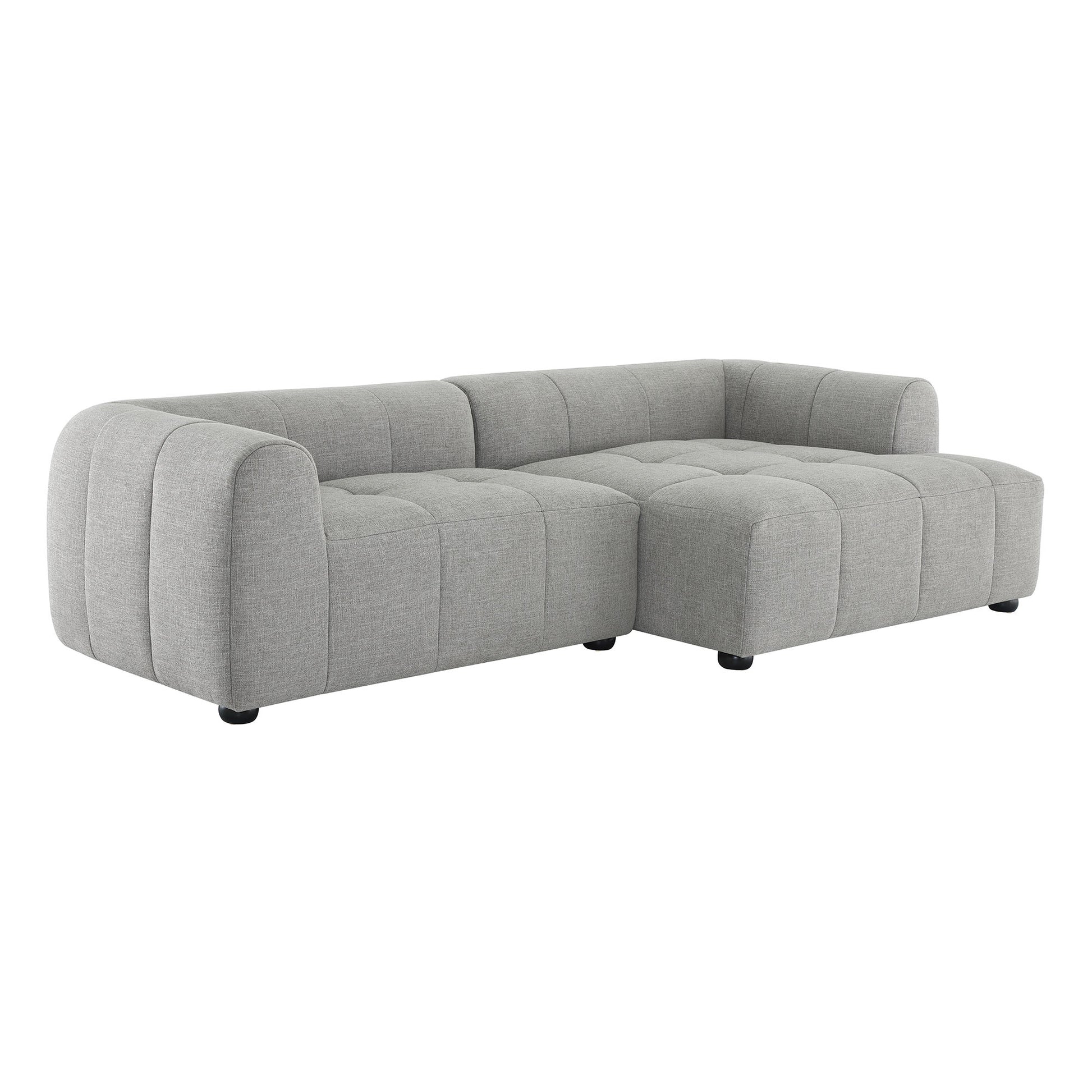 Light gray fabric modular sofa with right-facing chaise, rounded arms and tufted cushions.