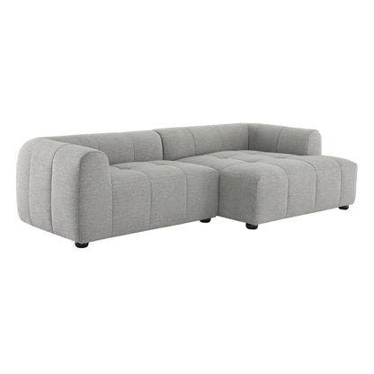 Light gray fabric modular sofa with right-facing chaise, rounded arms and tufted cushions.