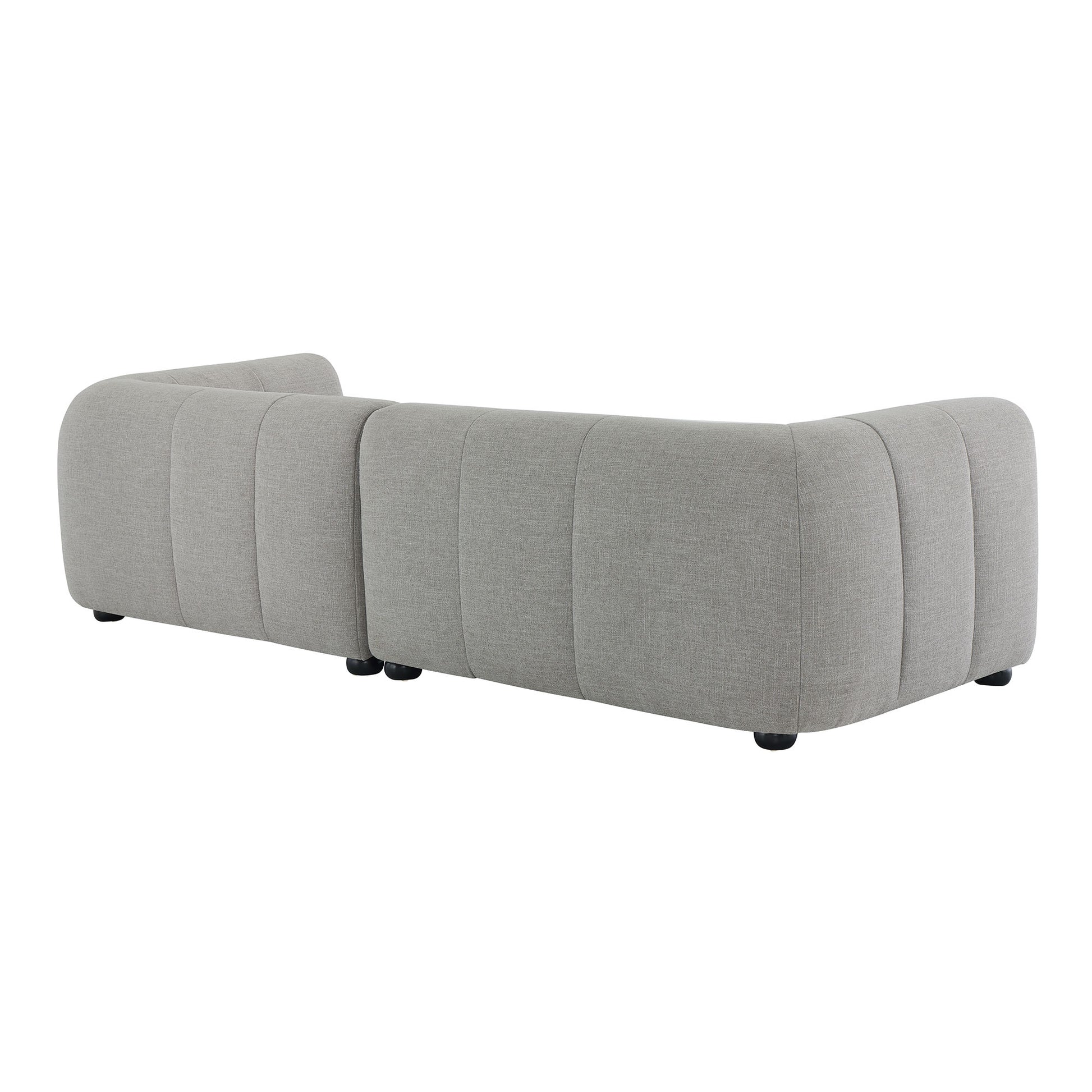 Three-piece modular sectional in light gray fabric with a chaise, rounded corners and low black feet.