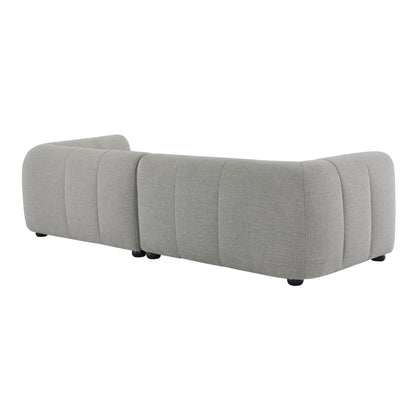 Three-piece modular sectional in light gray fabric with a chaise, rounded corners and low black feet.