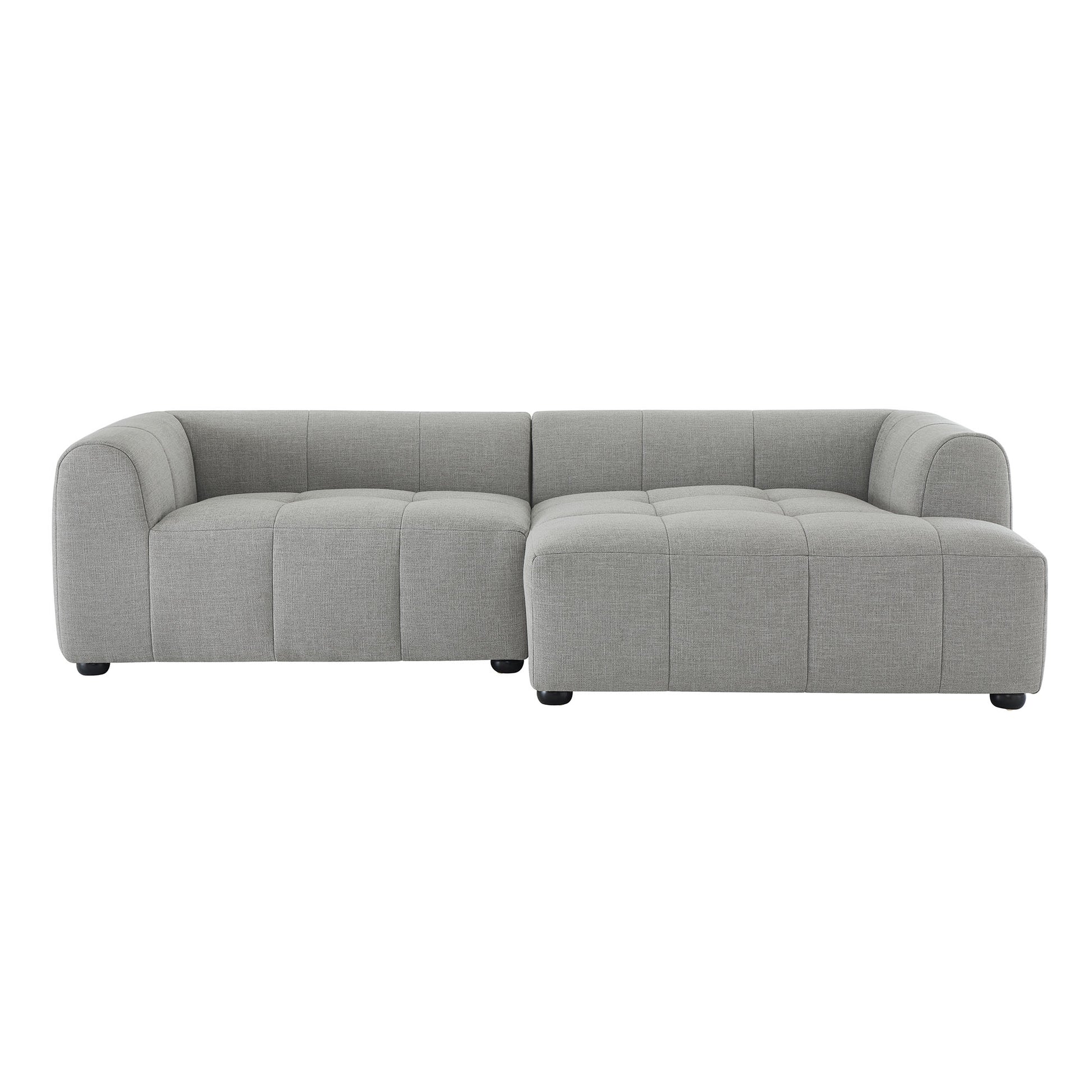 Light gray fabric L-shaped sectional sofa with tufted cushions and rounded arms, includes chaise.