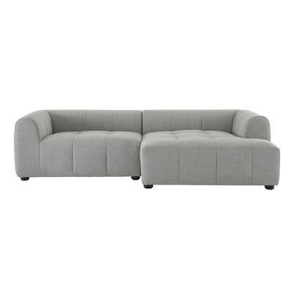 Light gray fabric L-shaped sectional sofa with tufted cushions and rounded arms, includes chaise.