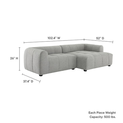 Light gray fabric modular sectional with chaise, tufted cushions, rounded arms, low legs; 102.4W x 52D x 26H