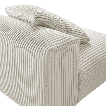 Almond corduroy armless modular chair with vertical ribbed fabric and matching cushion.