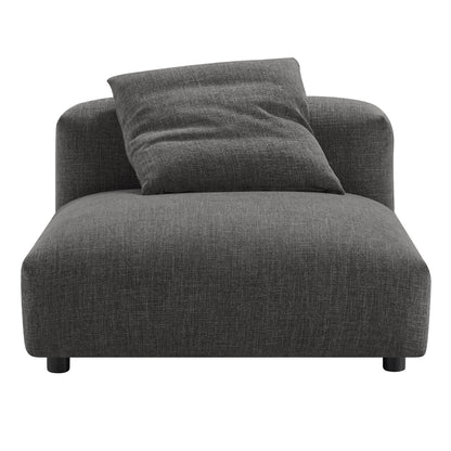 Dark gray fabric armless chair and ottoman set with low black legs.