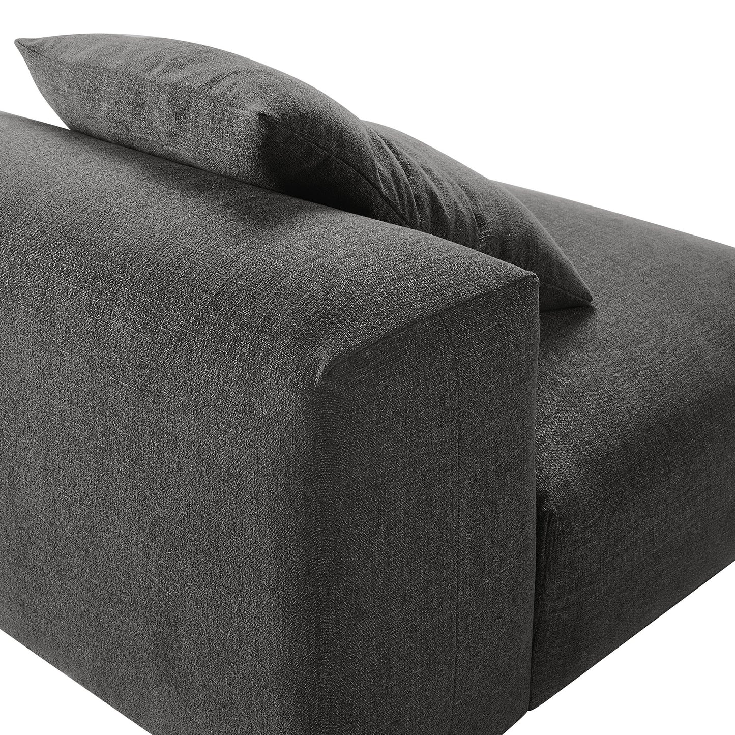Charcoal gray fabric armless chair in a modular living room sofa system.