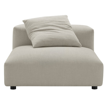Brown linen upholstery armless chair and ottoman set with a loose square pillow and short black legs.
