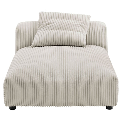 Beige ribbed corduroy armless chaise lounge with matching bolster pillow, modern low-profile design.