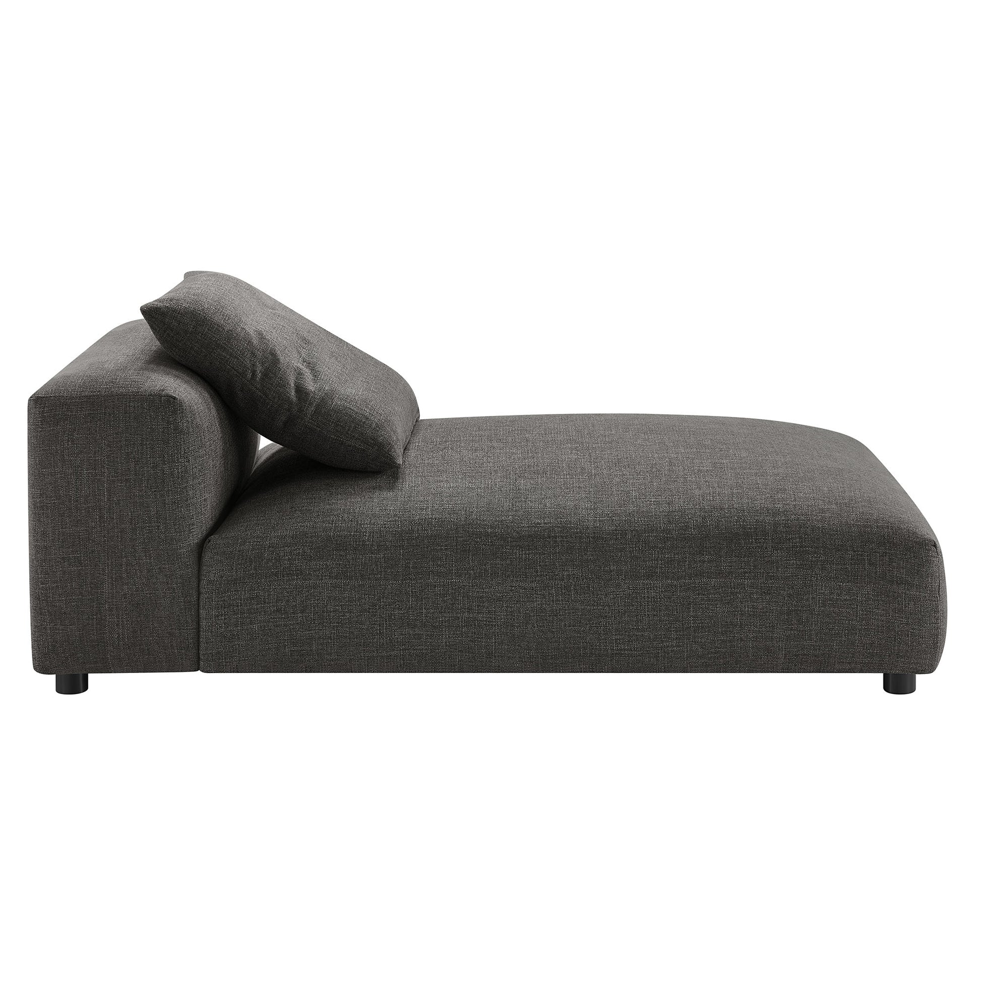 Charcoal gray fabric modular sectional sofa with chaise, low back and bolster pillow, modern minimalist style.