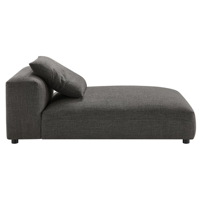 Charcoal gray fabric modular sectional sofa with chaise, low back and bolster pillow, modern minimalist style.