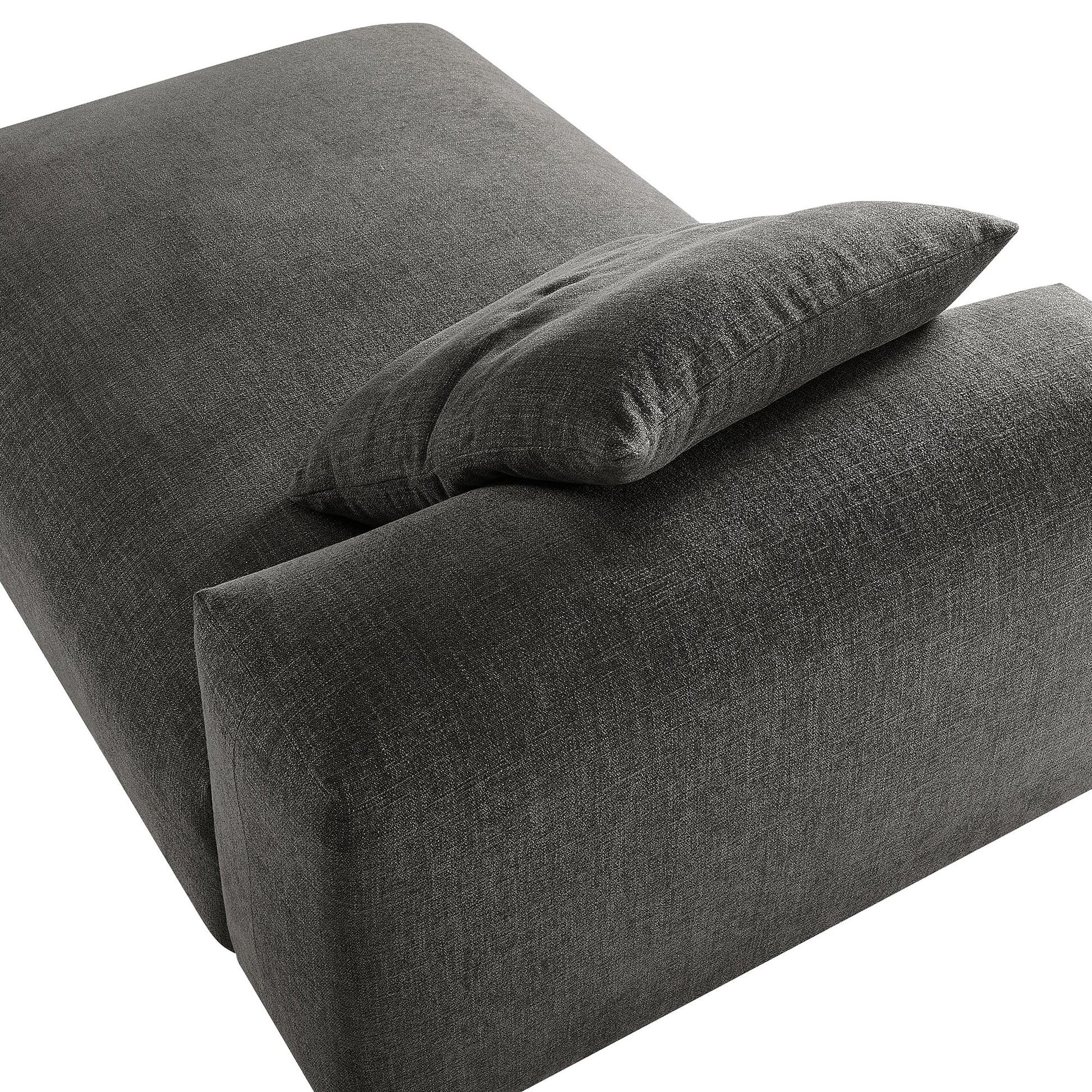 Charcoal gray fabric armless chaise lounge with a matching cushion, modern upholstered living room seating.