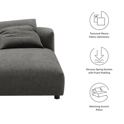 Dark gray textured weave fabric armless chaise lounge with a low-profile curved edge and a matching accent pillow.