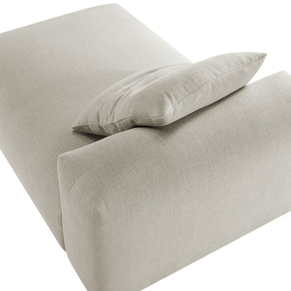 Beige linen fabric modular armless chaise lounge with a low-profile design and a matching throw pillow.