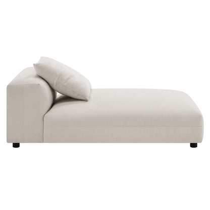 Gray fabric sectional sofa with chaise on the left, matching pillow, low black legs; contemporary living-room seating.