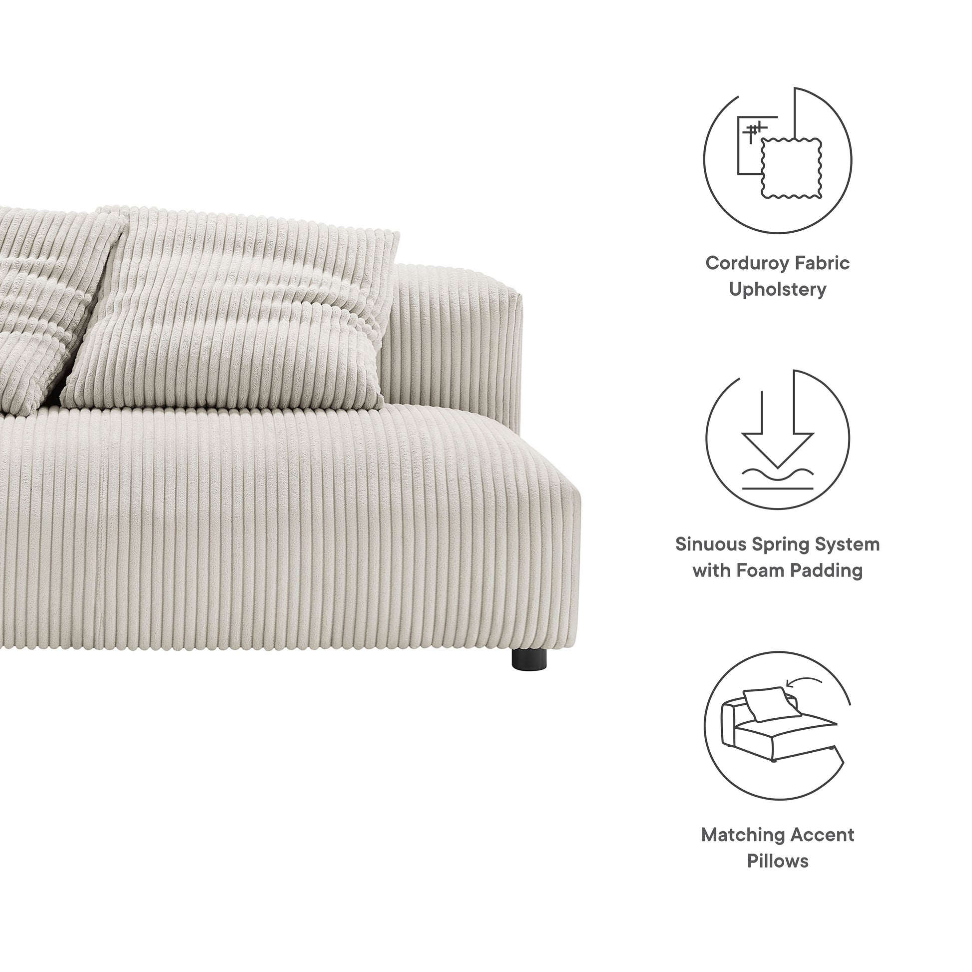 Beige corduroy armless loveseat with matching accent pillows; low-profile design with black legs.