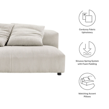Beige corduroy armless loveseat with matching accent pillows; low-profile design with black legs.