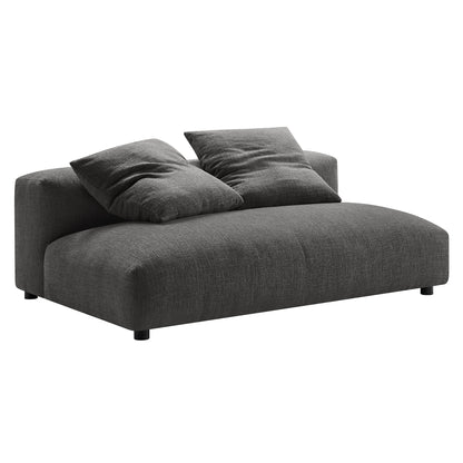 Charcoal gray fabric armless modular loveseat with ottoman and two cushions, low-profile modern design.
