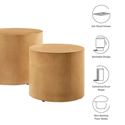 Two natural ash wood veneer round nesting coffee tables with non-marking floor glides.