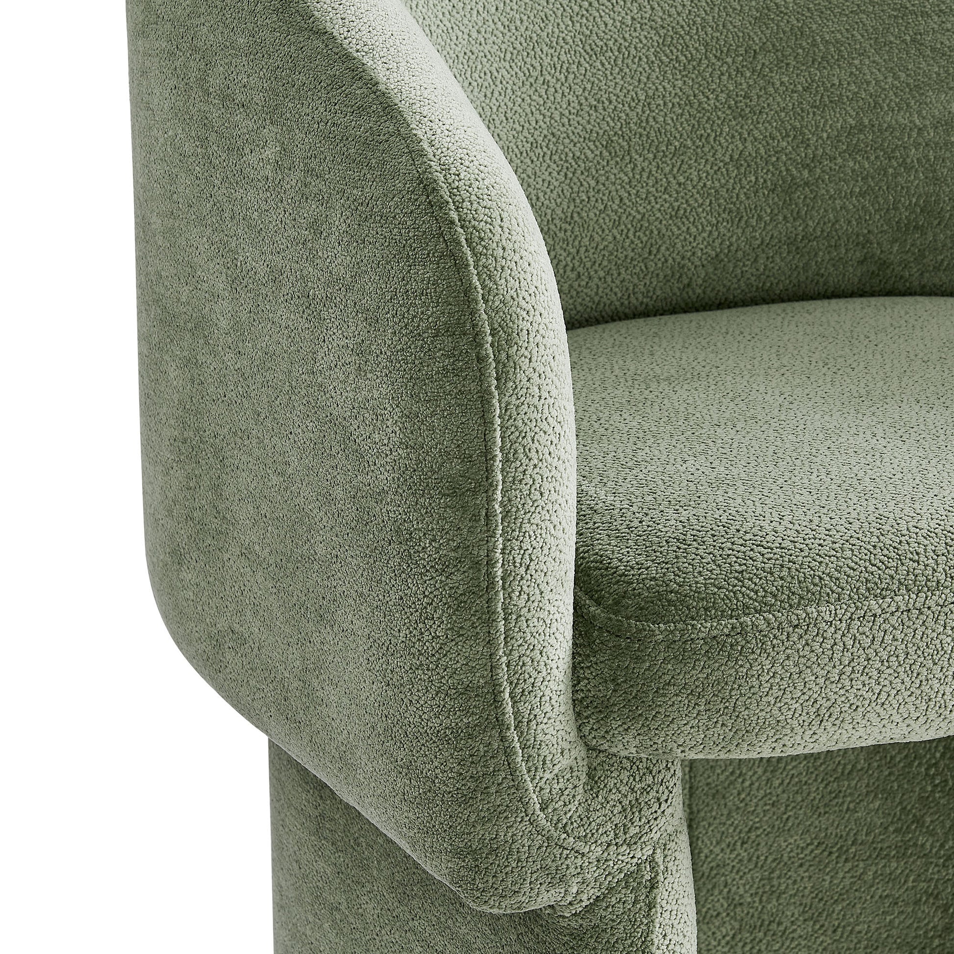 Sage green chenille dining armchair with curved armrest and plush cushion.