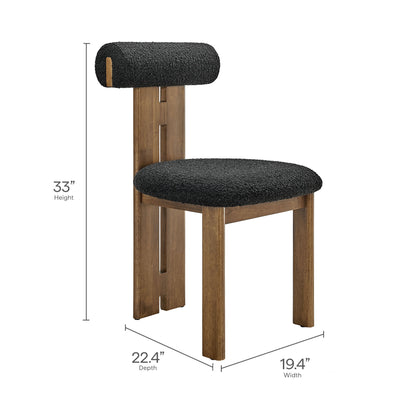 Pair of walnut wood-frame dining chairs with black textured seats and cylindrical back cushions; 33 in height.