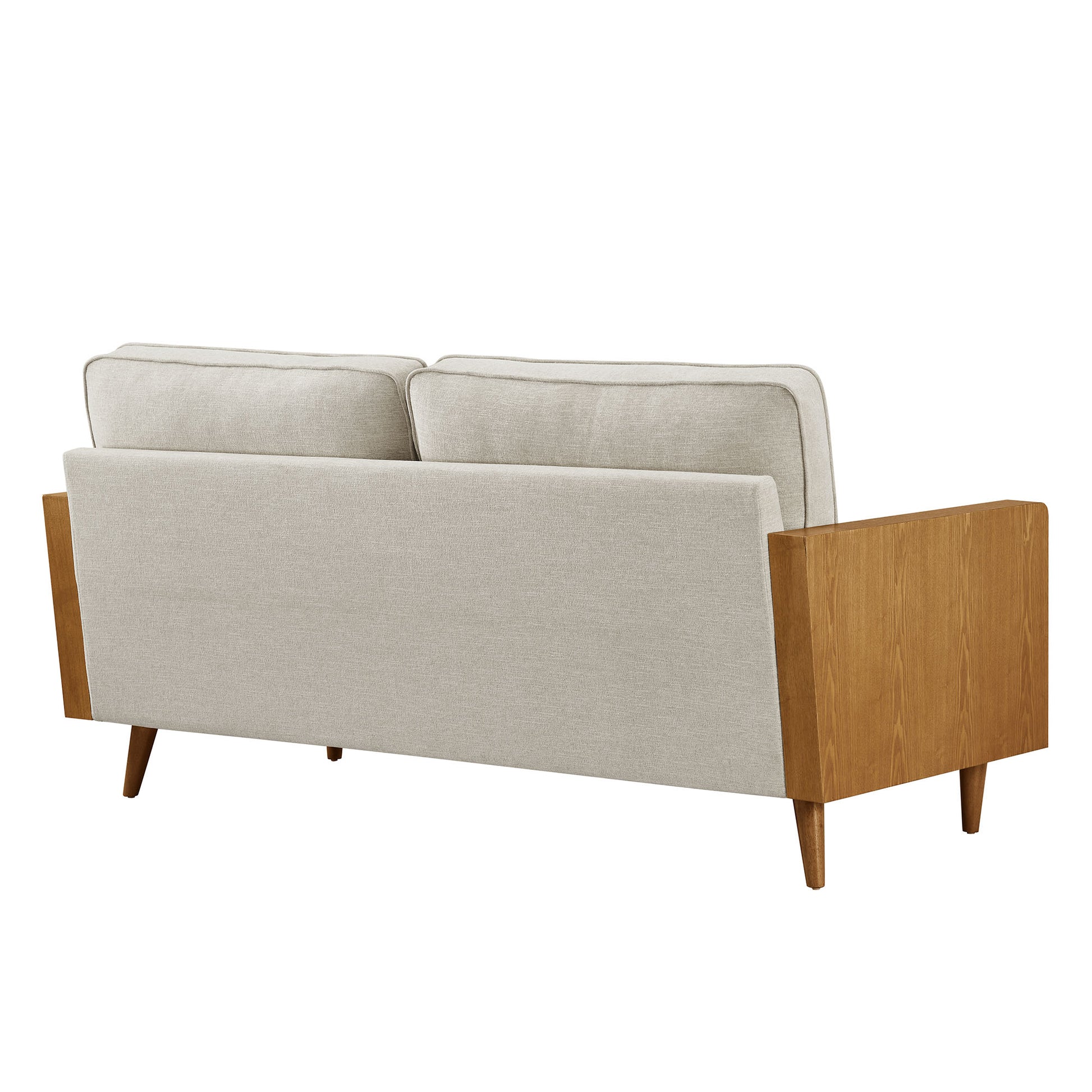 White fabric sofa with walnut wood frame and tapered legs in a mid-century style, with back cushions.