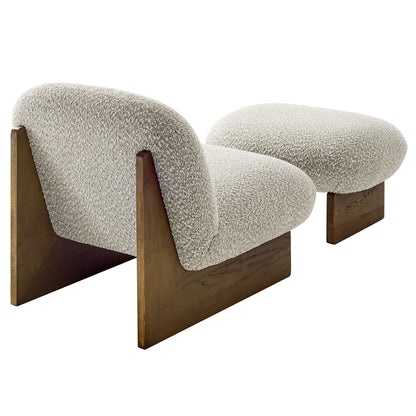 Cream boucle upholstered accent chair and ottoman set with walnut wood bases and rounded backs.