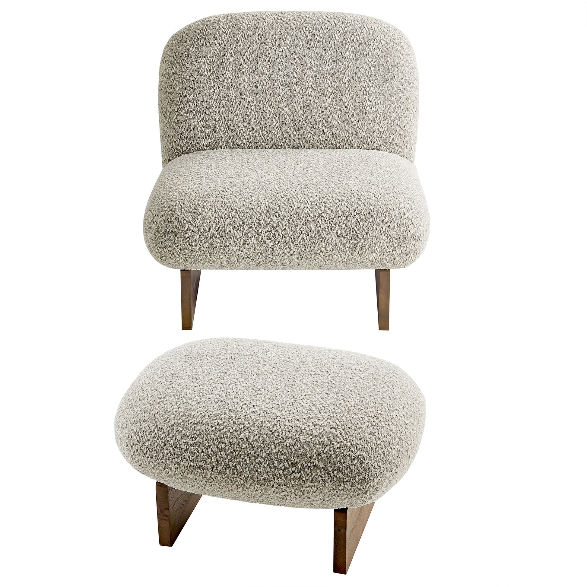 Beige boucle lounge chair with rounded back & seat and matching oval ottoman on walnut wooden legs.