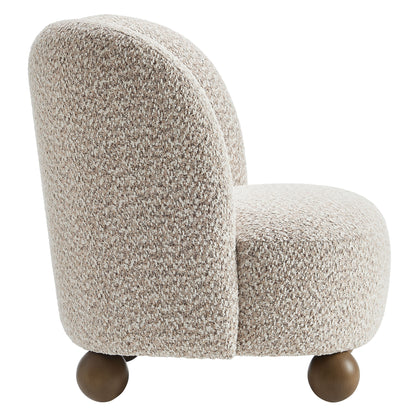 Brown boucle fabric accent chair with a rounded back and seat on walnut wooden ball feet.