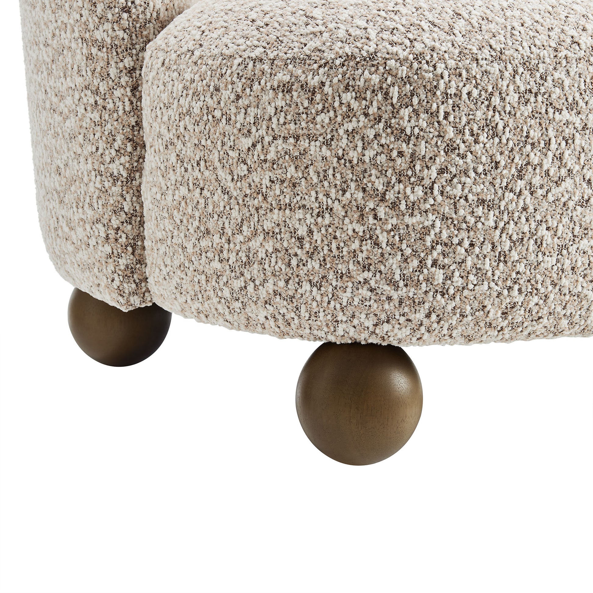 Brown boucle fabric accent chair with rounded walnut wood ball feet.