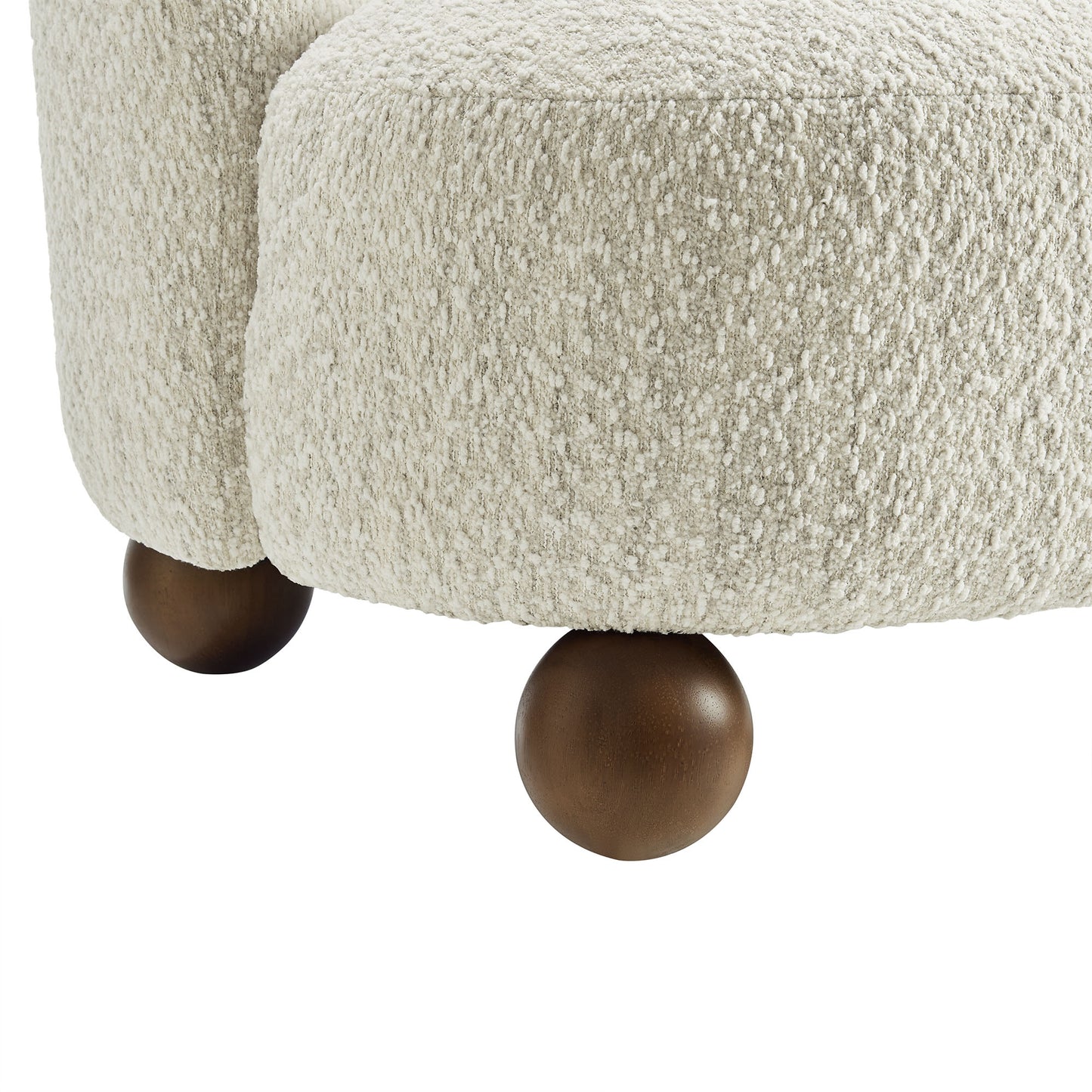 Cream boucle fabric accent chair with walnut wood ball feet.