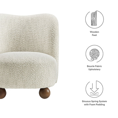 Brown boucle fabric accent chair with curved back and rounded wooden feet, mid-century style seating.