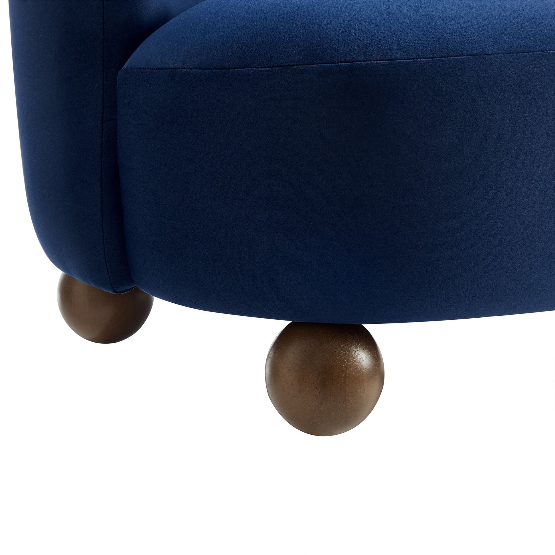 Brown velvet accent chair with rounded wooden ball feet.
