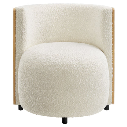 Ivory boucle fabric accent chair with natural wood sides and short black legs; curved back and round barrel seat.