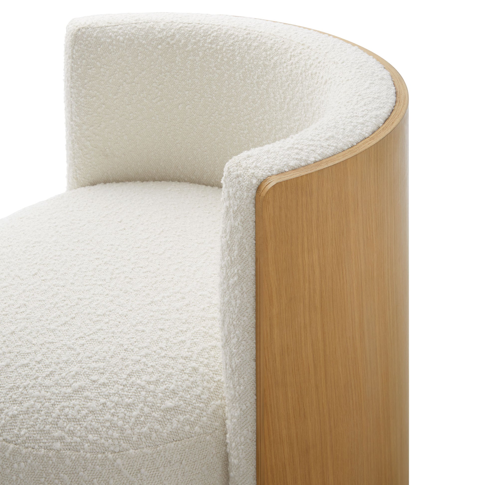 Natural wood curved-arm chair with ivory boucle upholstery and rounded back.