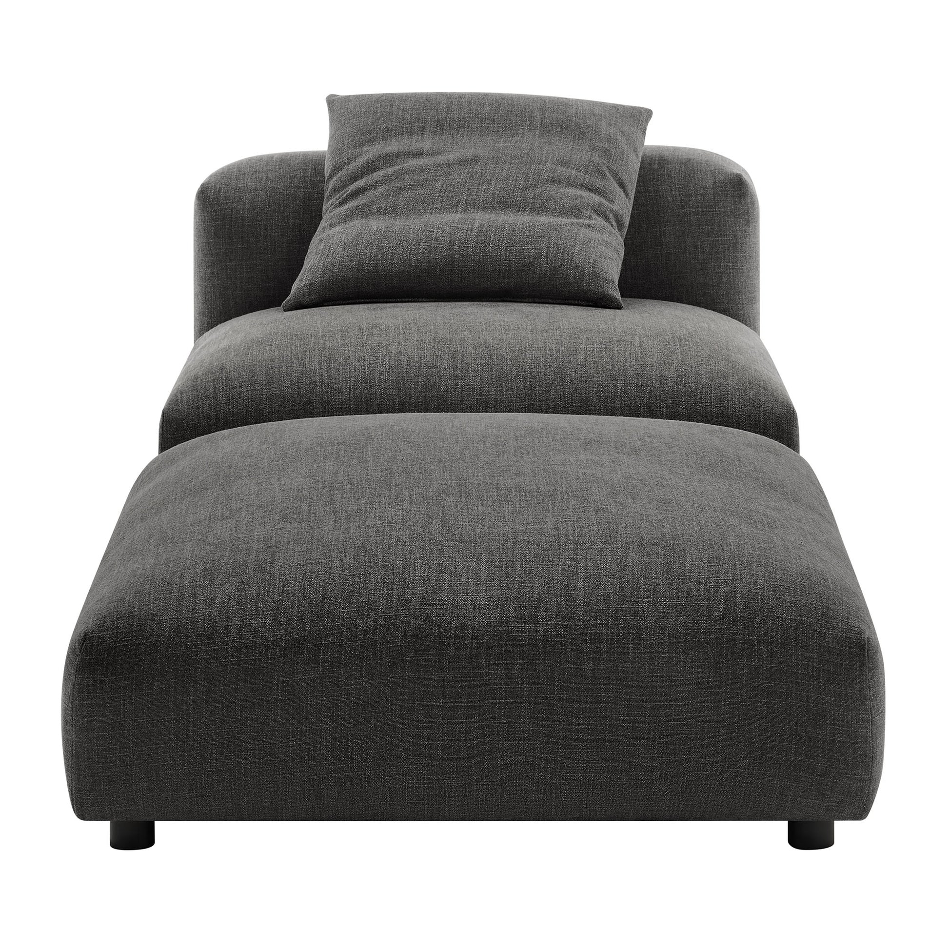 Dark gray fabric armless chair with matching ottoman and low-profile legs.