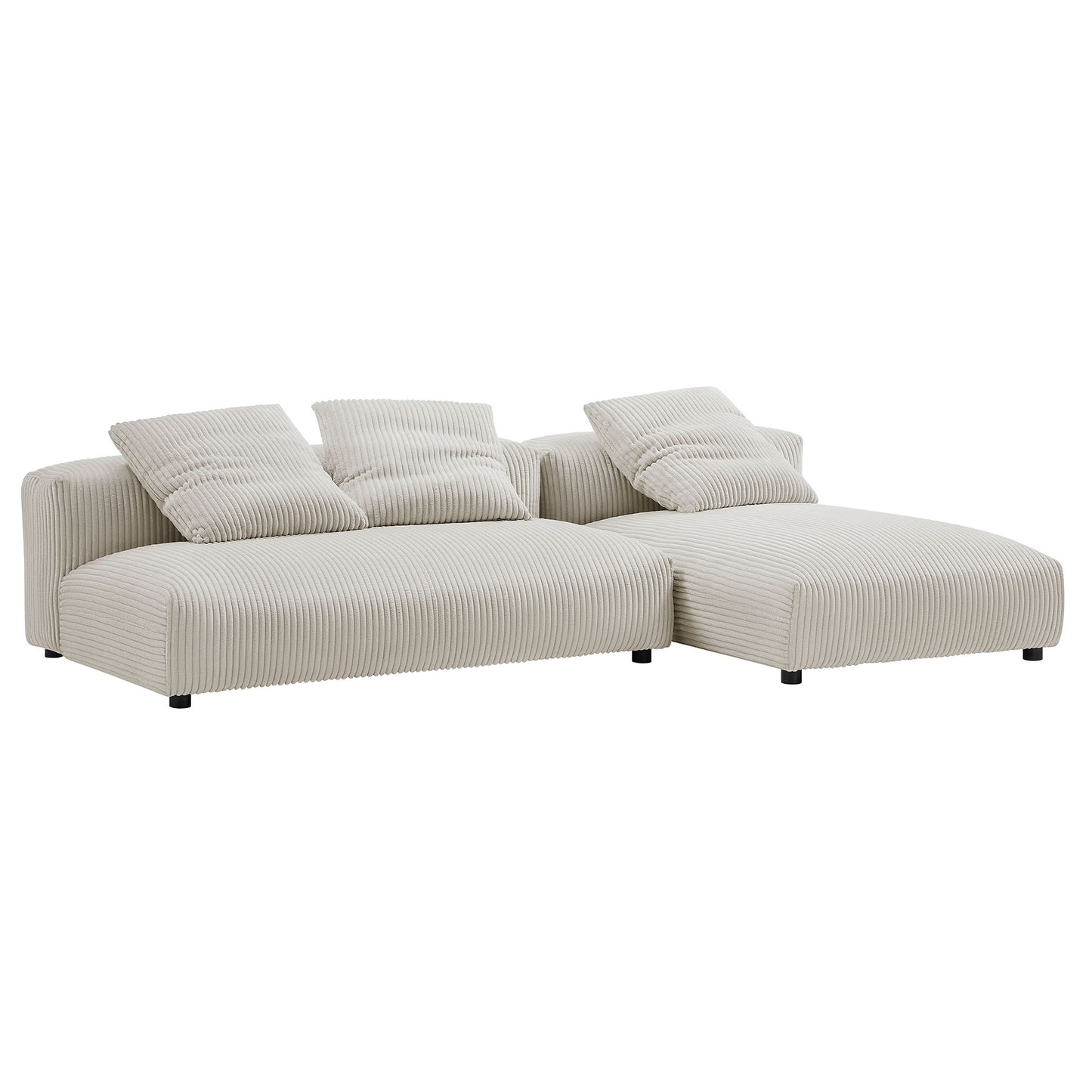 Almond beige ribbed fabric modular sectional with right-side chaise and cushions, low-profile legs.